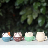 Cat In A Cup wooden figurines, hand-carved and painted.
